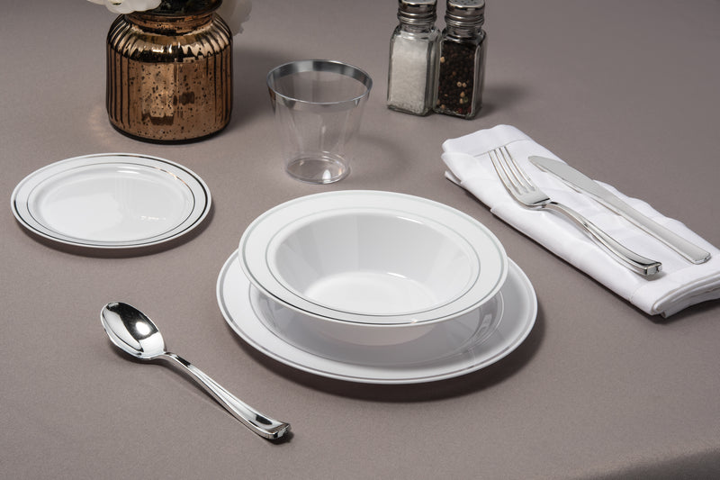 set of Silver Rimmed white Bowls plates cups and cutlery 